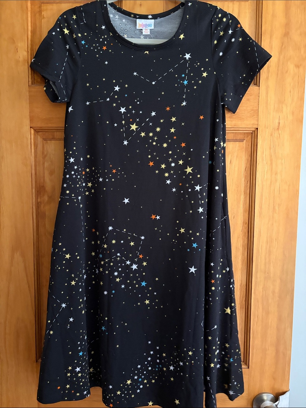 LuLaRoe Jessie Black Dress with Yellow, White, Blue and Orange Star Print